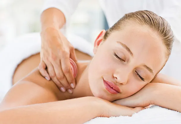 A colour image f a lady receiving a full body massage by Vicki Hooper Beauty - Headley Down and Grayshott
